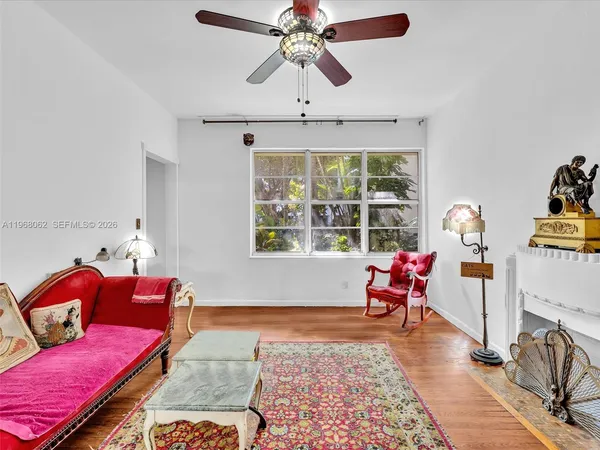 a living room with furniture and a window