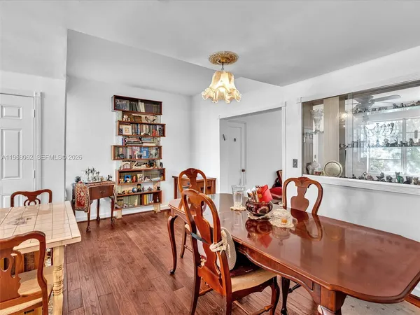 a living room with lots of furniture and clutter