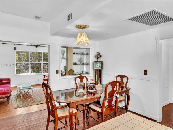 a view of a dining room and a table and chairs
