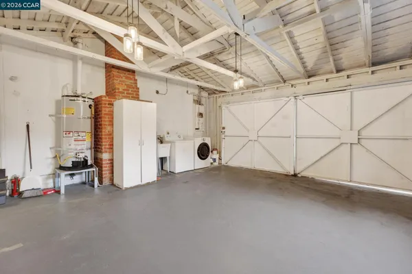 a view of a storage & utility room with stainless steel appliances