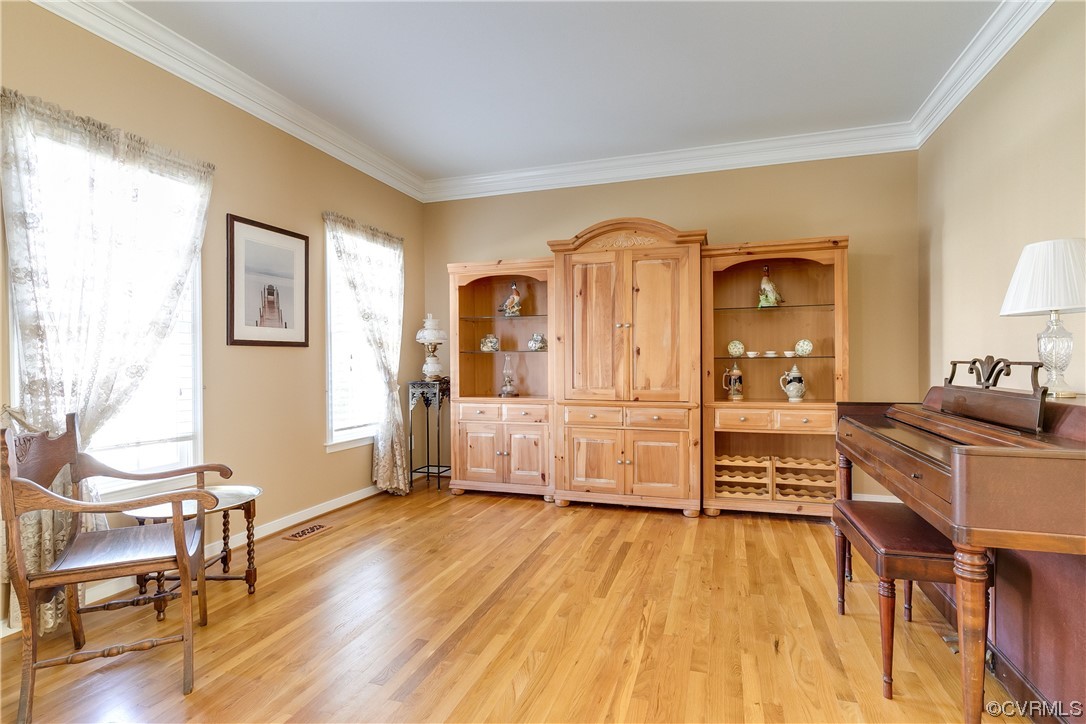 719 Biggin Pond Road Midlothian, VA 23114 - Photo 8 of 41 a living room with furniture and a wooden floor