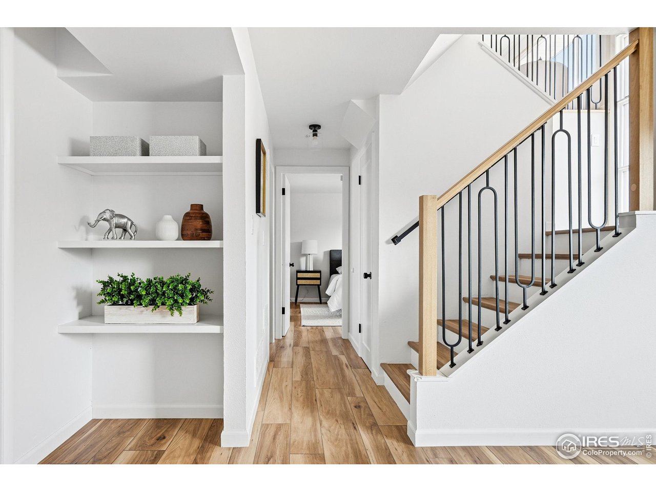 2830 Duke Circle Boulder, CO 80305 - Photo 20 of 43 Custom railing leading to the lower level with built ins. Luxury Vinyl wood flooring in the lower level.