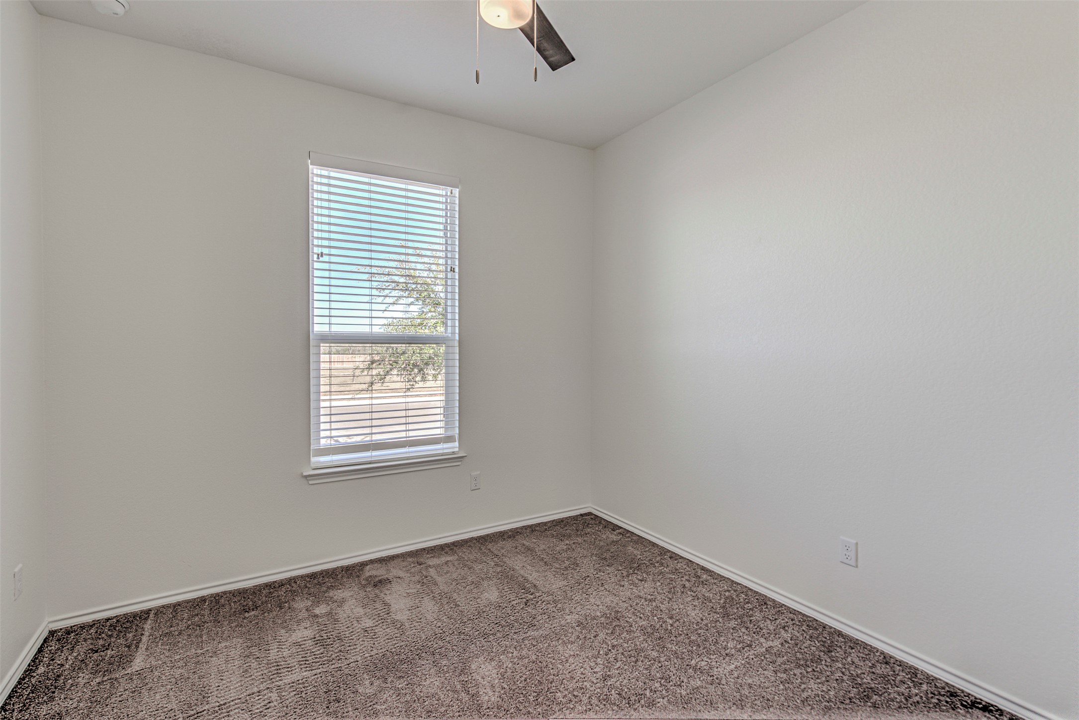 486 Gustaf Trail Kyle, TX 78640 - Photo 15 of 40 an empty room with a window