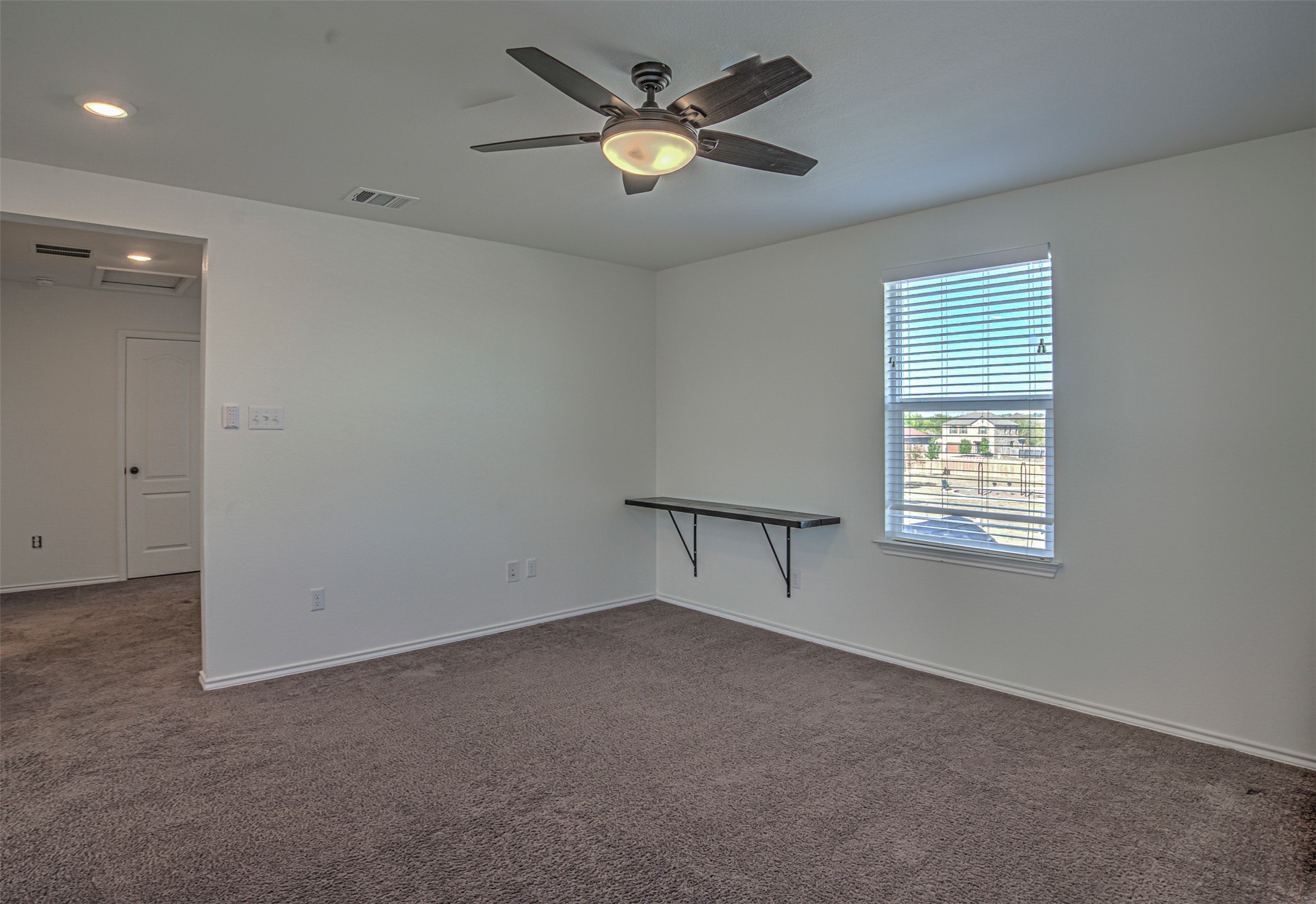 486 Gustaf Trail Kyle, TX 78640 - Photo 19 of 40 a view of an empty room with a window