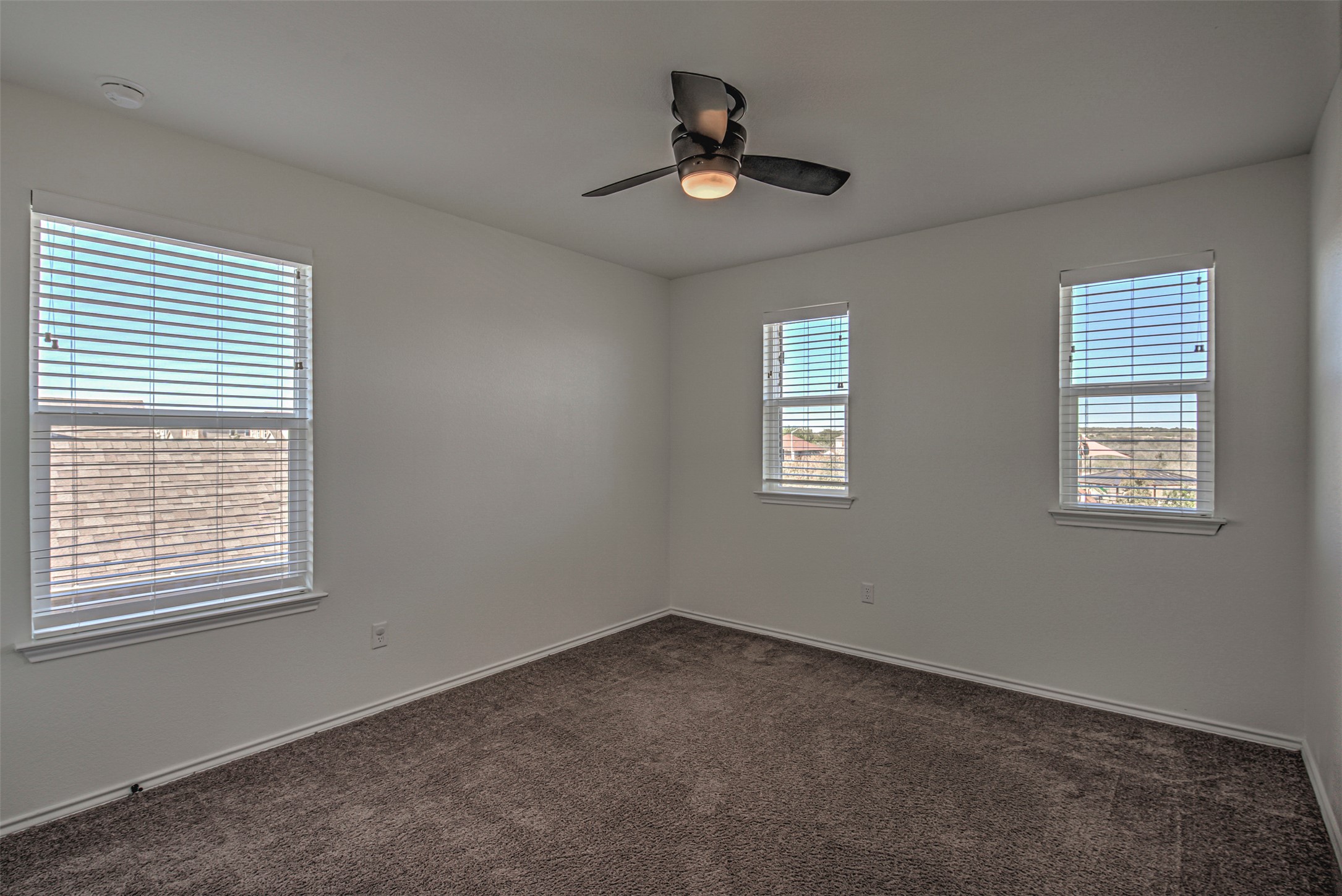 486 Gustaf Trail Kyle, TX 78640 - Photo 21 of 40 a view of an empty room with a window
