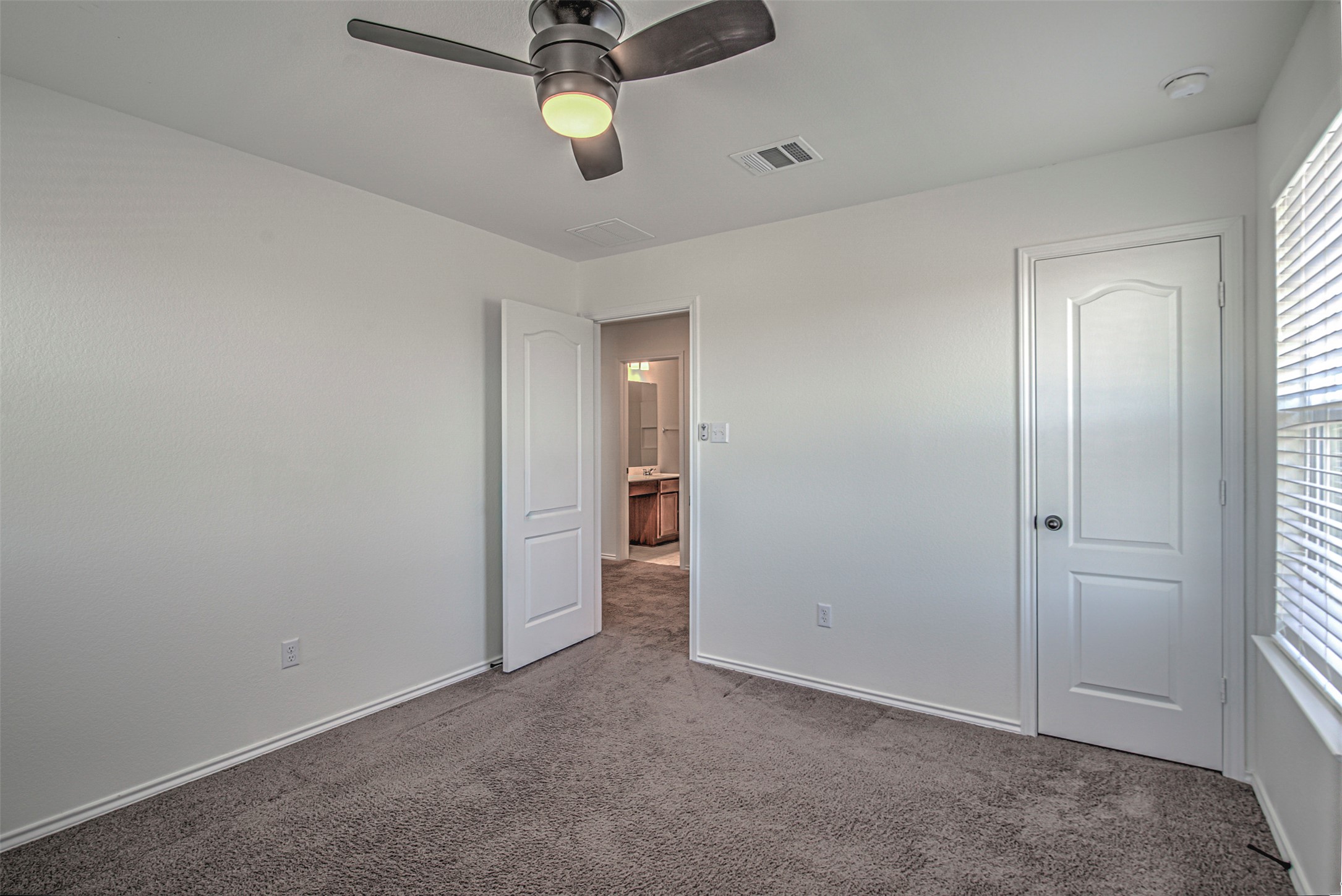 486 Gustaf Trail Kyle, TX 78640 - Photo 22 of 40 an empty room with windows and closet
