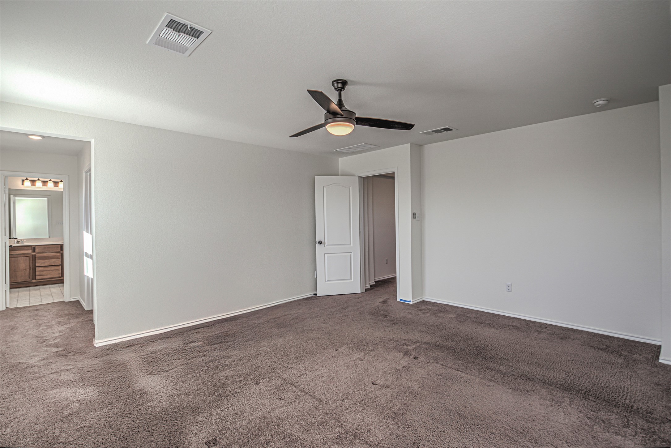 486 Gustaf Trail Kyle, TX 78640 - Photo 27 of 40 a view of a chandelier fan in an empty room