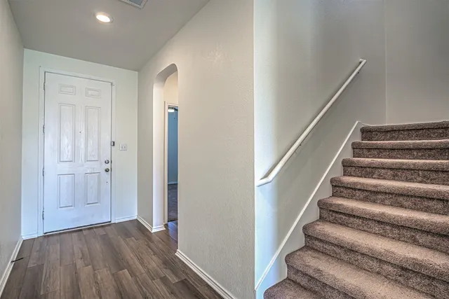 a view of entryway with wooden floor