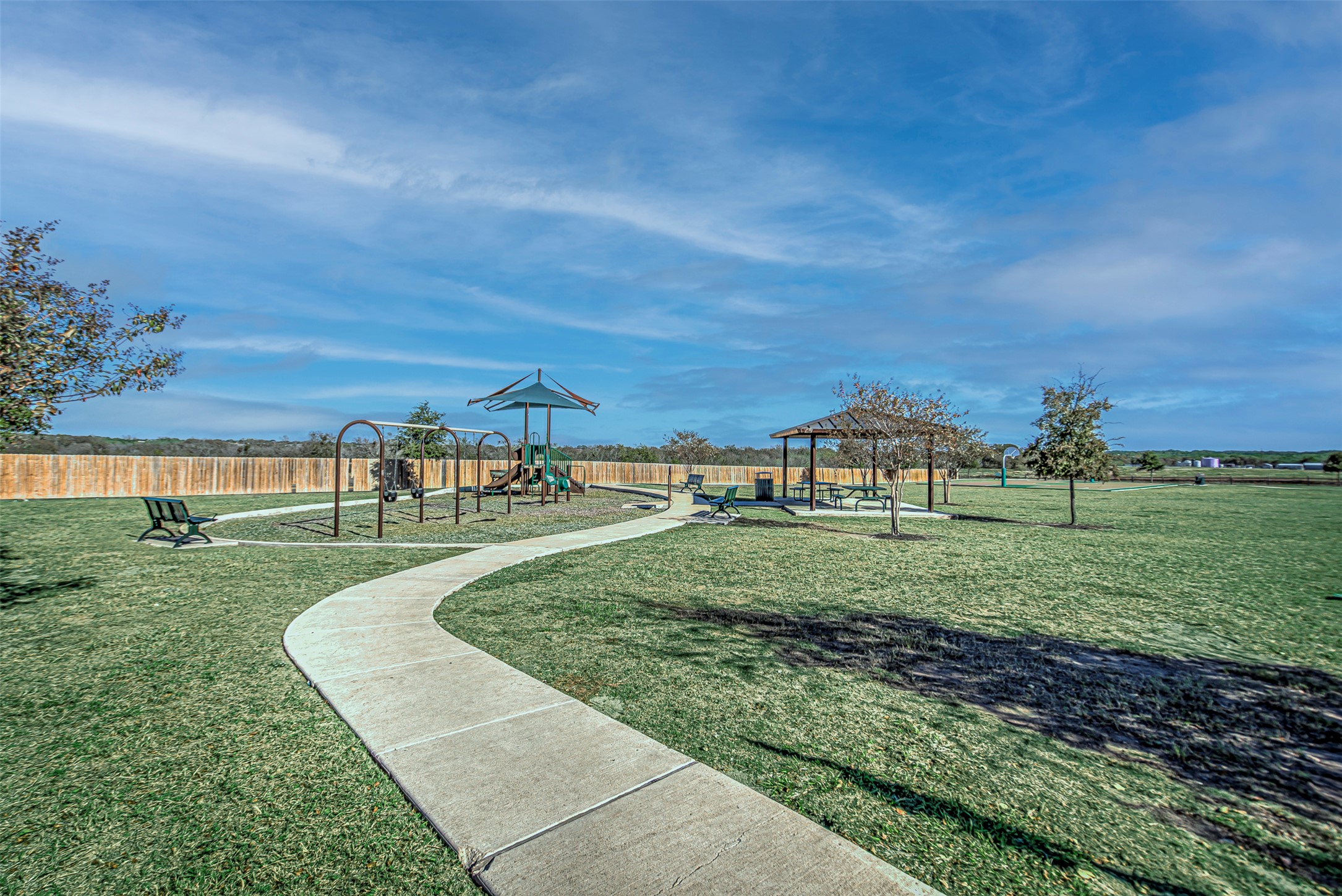486 Gustaf Trail Kyle, TX 78640 - Photo 36 of 40 a view of a big yard with a house in the background
