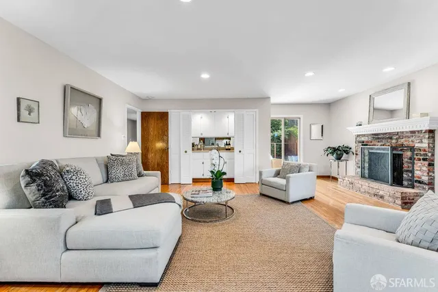 a bedroom with a bed and a potted plant