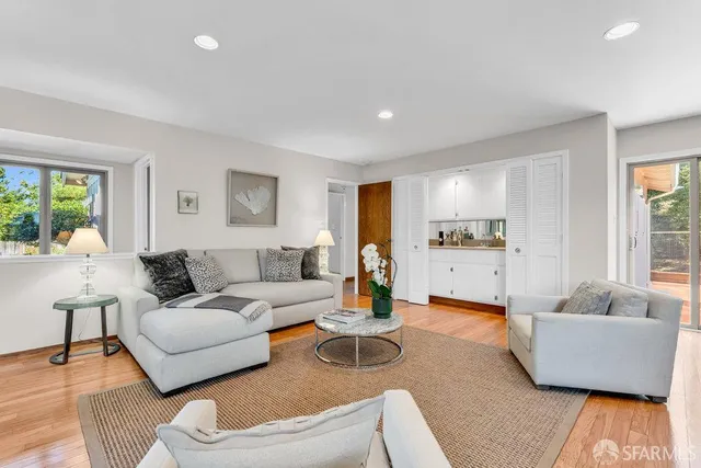a living room with furniture and a table