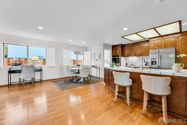 a bedroom with a bed and a chair