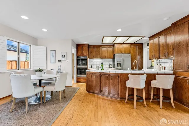 a bedroom with a bed and a table