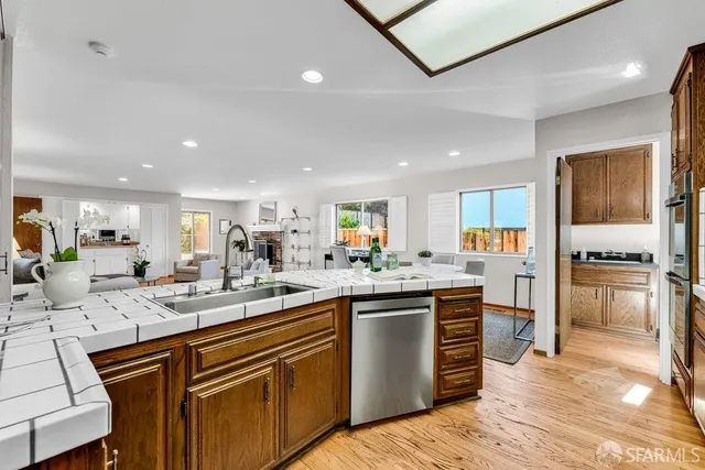 a view of a house with swimming pool and sitting area