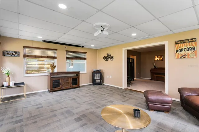 a kitchen with stainless steel appliances granite countertop a refrigerator a sink and a stove