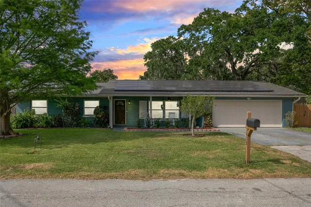 a view of a dining room with furniture and window