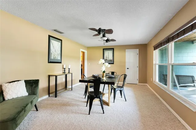 a bed room with furniture and a large window