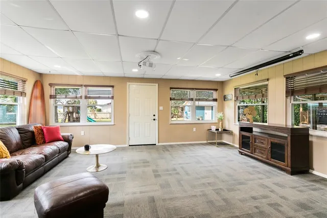 a kitchen with stainless steel appliances granite countertop a stove a sink dishwasher and a refrigerator with wooden floor