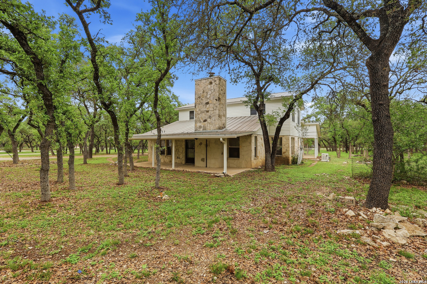 261 Fawn Lane Spring Branch, TX 78070 - Photo 31 of 44 a front view of a house with a garden
