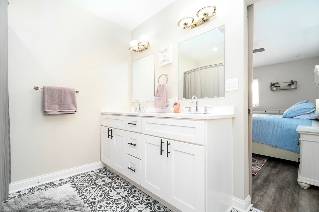 2235 West Acres Road Joliet, IL 60435 - Photo 15 of 26 a bathroom with a sink and a mirror