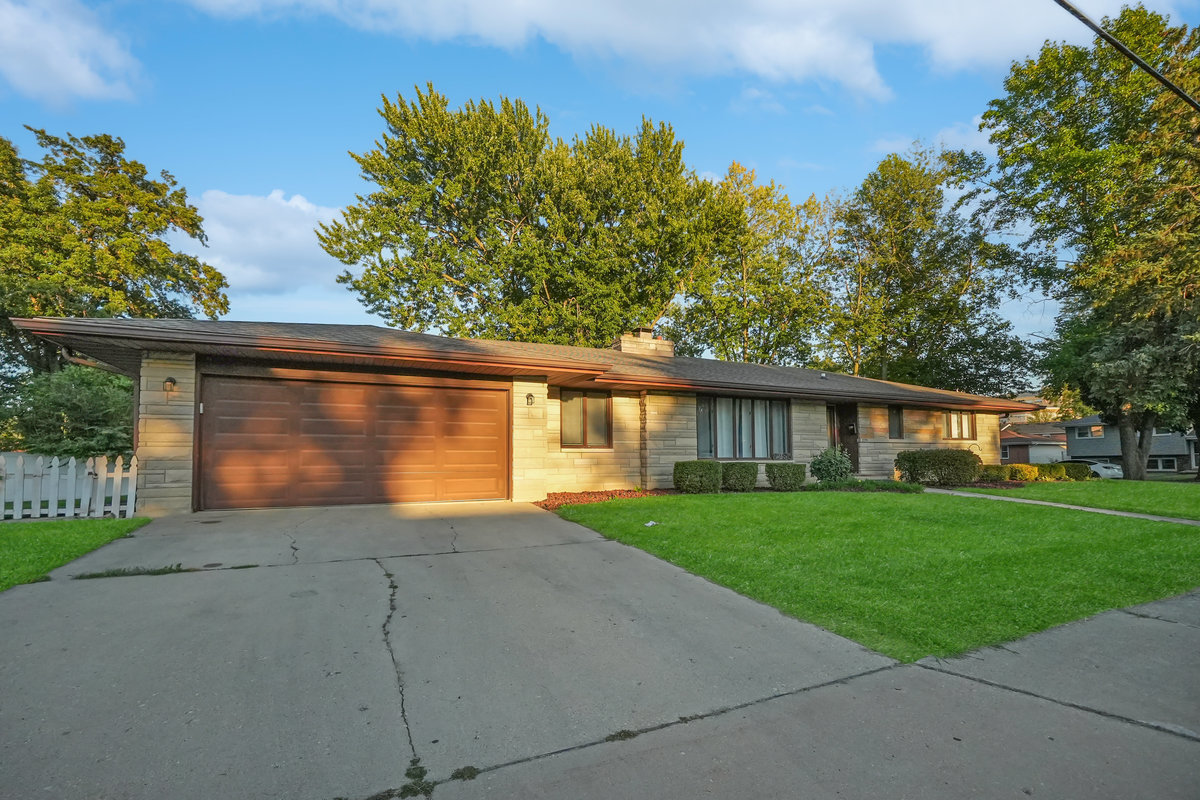 2235 West Acres Road Joliet, IL 60435 - Photo 3 of 26 two view of a house with a yard and a garden