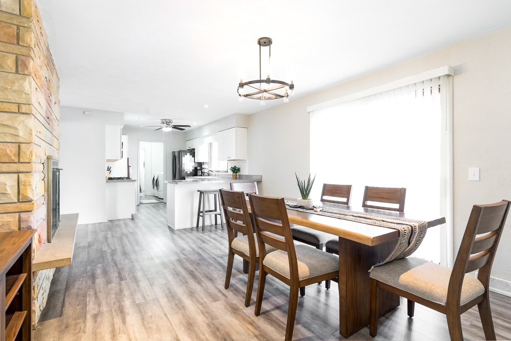 2235 West Acres Road Joliet, IL 60435 - Photo 10 of 26 a view of a dining room with furniture and wooden floor