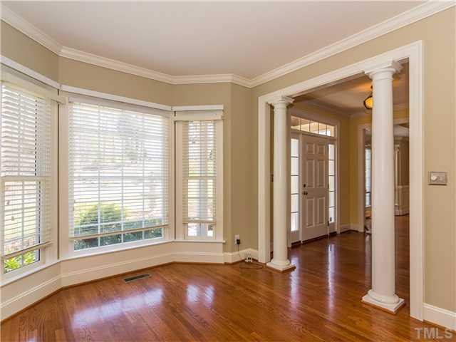 8677 Barrett Ridge Road Wake Forest, NC 27587 - Photo 3 of 25 The formal living room has a wonderful bay window which provides lots of natural light. The columns add an edge of elegance and sophistication to this lovely room. The color palate and neutral. Living Room