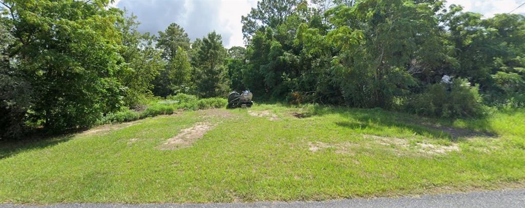 0 Pintado Avenue Spring Hill, FL 34609 - Photo 3 of 8 a view of swimming pool from a yard