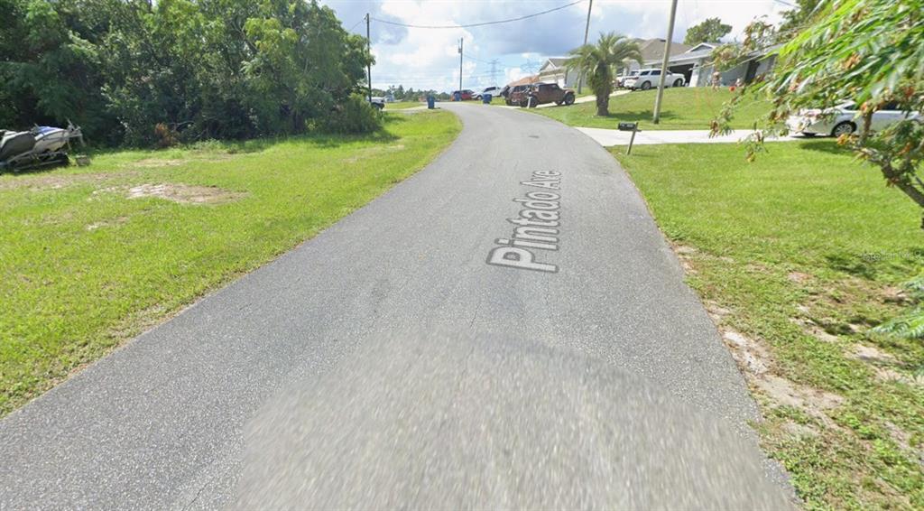 0 Pintado Avenue Spring Hill, FL 34609 - Photo 6 of 8 a view of a street with a park