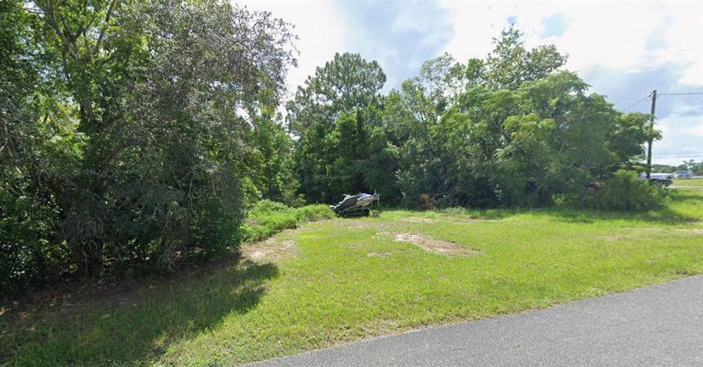 0 Pintado Avenue Spring Hill, FL 34609 - Photo 7 of 8 a swimming pool with wooden fence