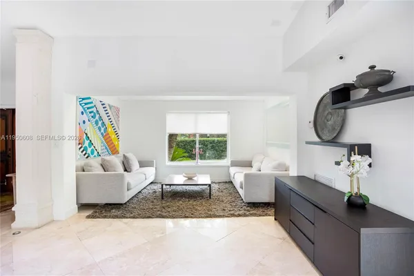 a living room with furniture and a window