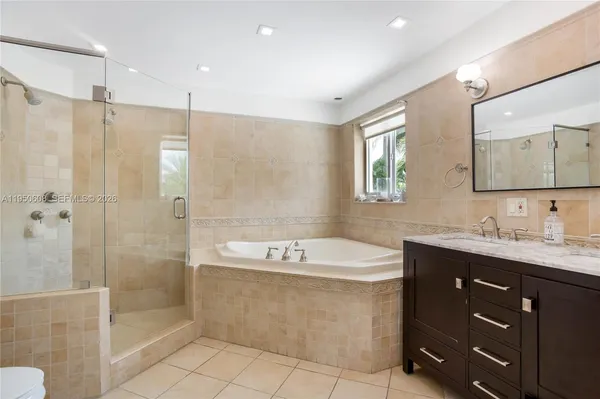 a bathroom with a sink double vanity and shower