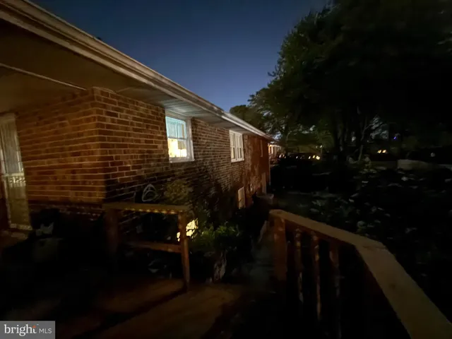 a view of a room with a table and chairs