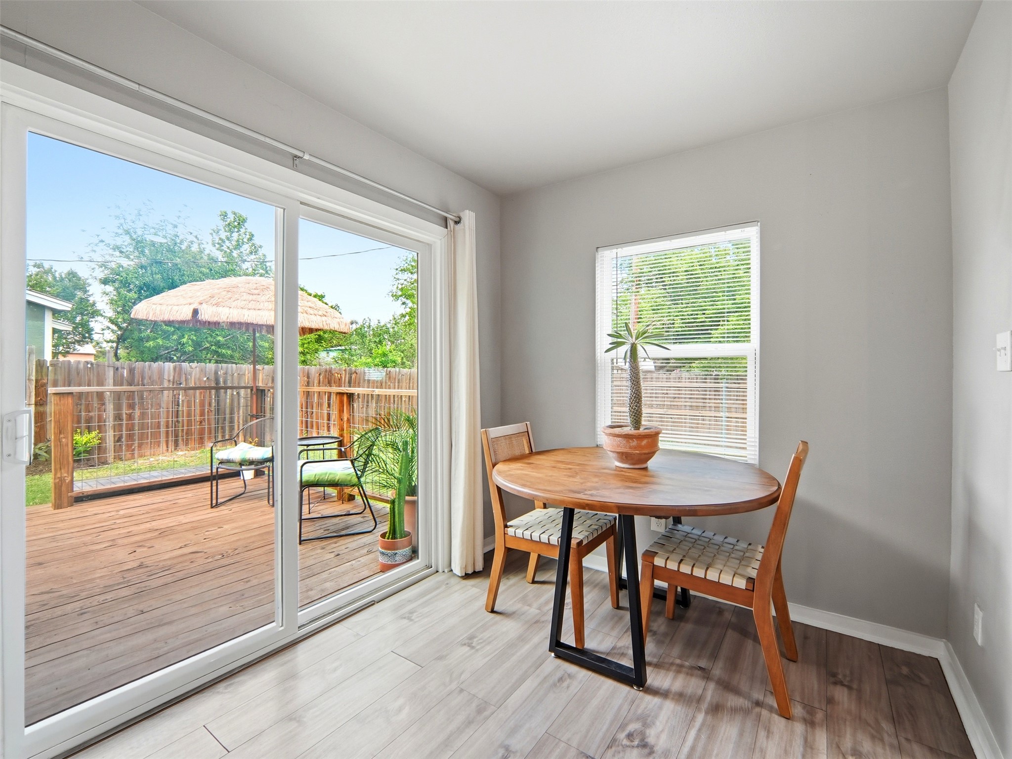700 9th Street Blanco, TX 78606 - Photo 22 of 33 a dining room with wooden floor and a table