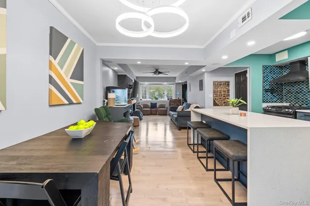 a view of a dining room with furniture and a table