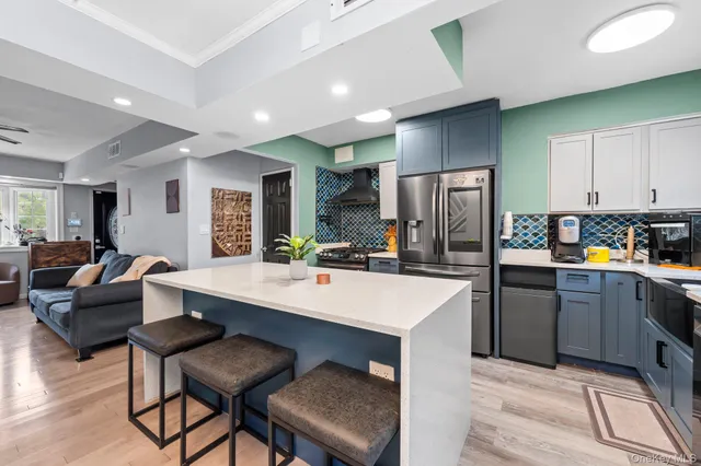 a kitchen with refrigerator cabinets and furniture