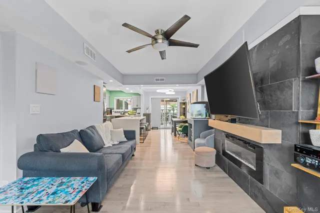 a living room with furniture and a clock