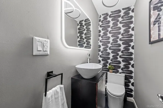 a bathroom with a toilet and a sink