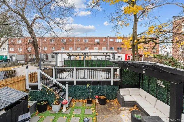 a view of a chairs and table in the balcony