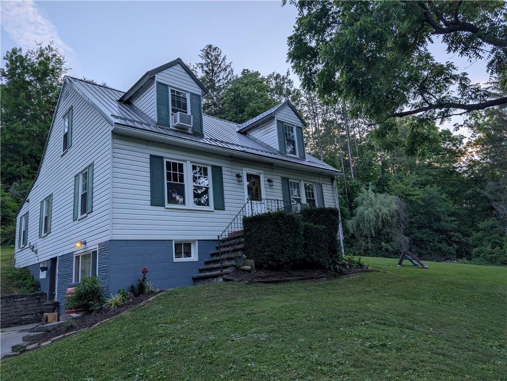 205 Woods Road Ligonier, PA 15658 - Photo 18 of 32 a view of a house with a yard