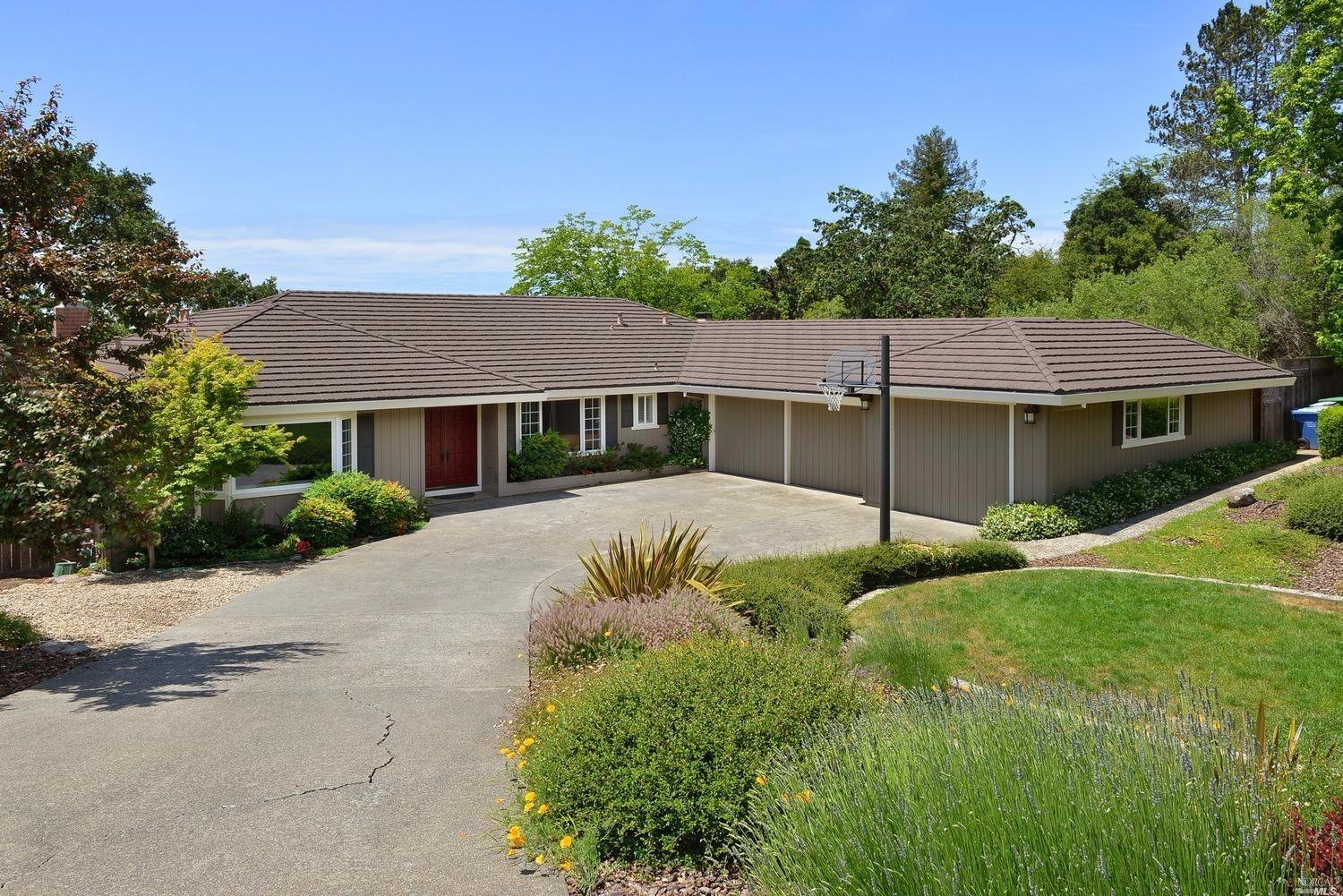 a view of house with a yard