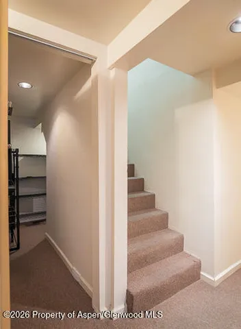a kitchen with a sink cabinets and window