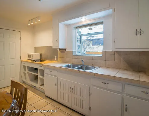 a kitchen with a sink cabinets and a granite counter top