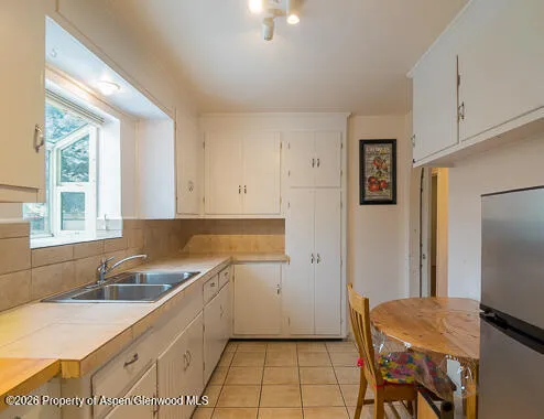 a bedroom with a bed and dresser