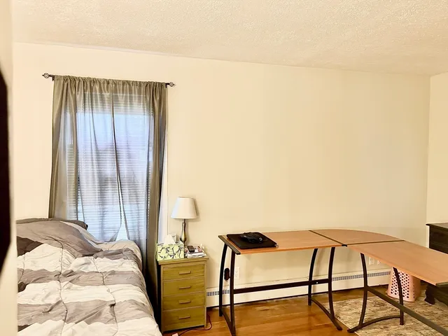 a bedroom with a bed and large closet