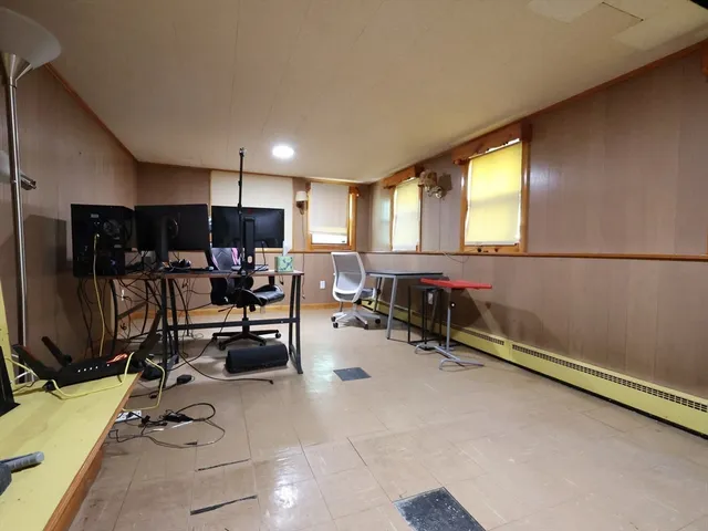 a room with gym equipment and a large window