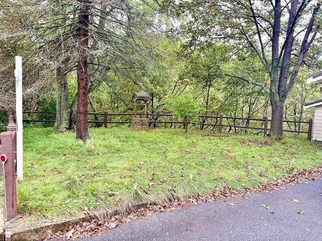 a backyard of a house with lots of green space