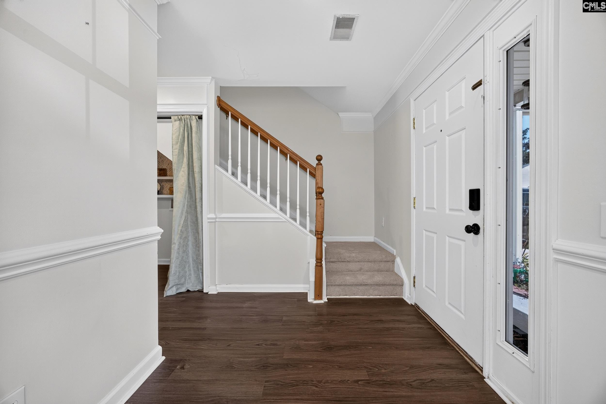 407 Sesqui Trail Columbia, SC 29223 - Photo 7 of 34 a view of a hallway with wooden floor and entryway
