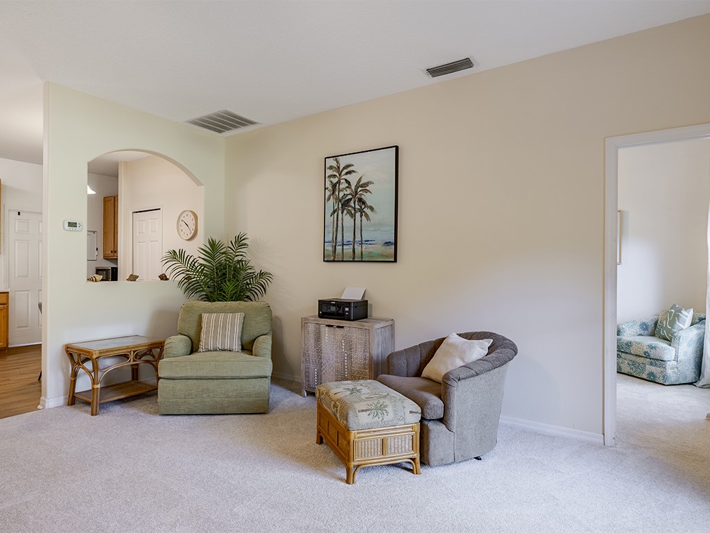3648 2nd Street Southwest Vero Beach, FL 32968 - Photo 11 of 36 a living room with furniture and a potted plant