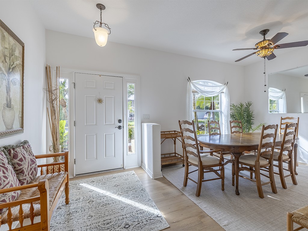 3648 2nd Street Southwest Vero Beach, FL 32968 - Photo 12 of 36 a view of a dining room with furniture and chandelier